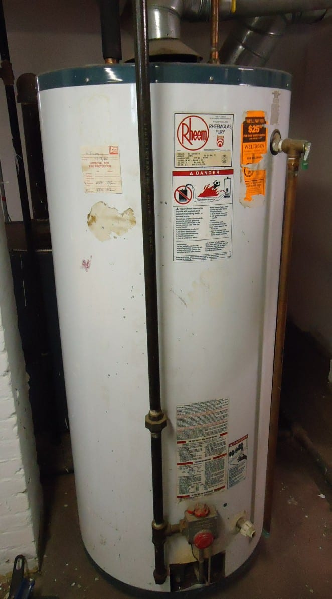 Gas water-heater tank and connected pipes, representative equipment photograph